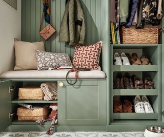 green built in boot room storage with open cupboards and doors