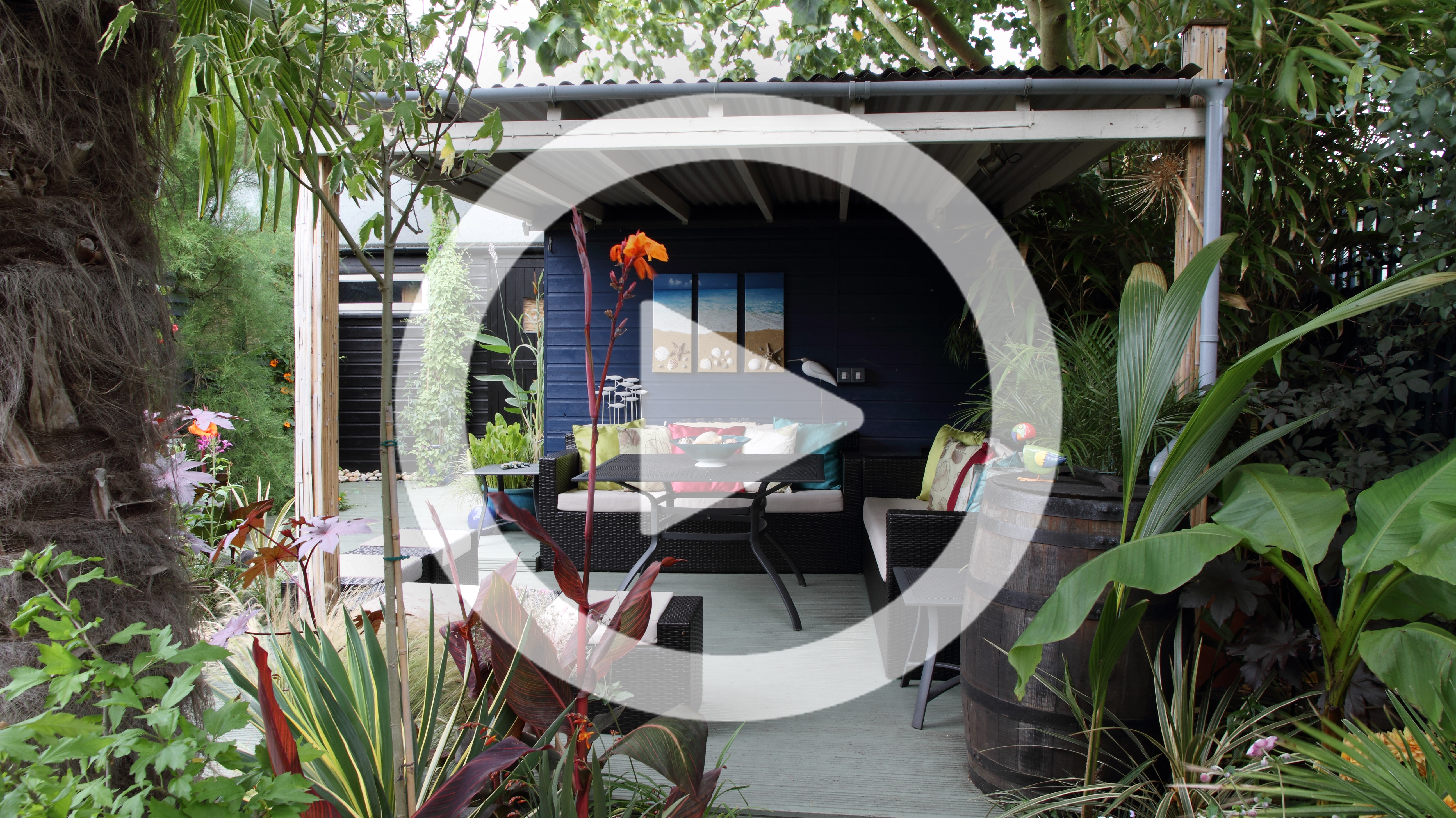 Beautiful garden with covered seating area and lush planting 