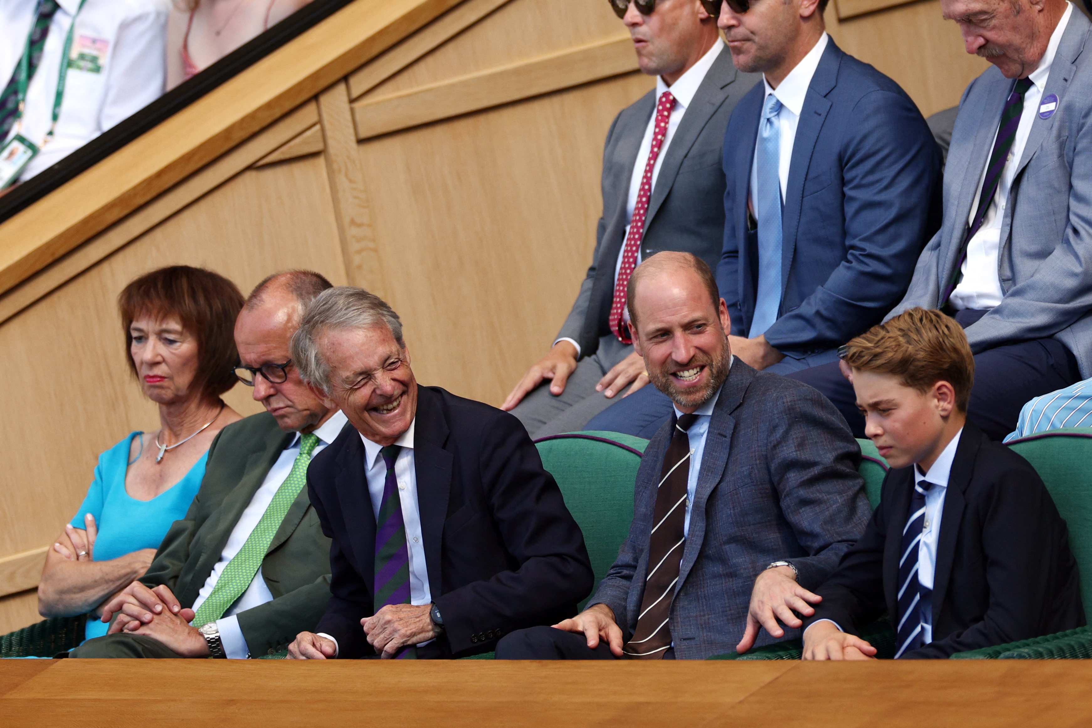 Prince William wears a suit to attend Wimbledon 2026 where he reassures his children, Prince George and Princess Charlotte, as they're met by crowds of people