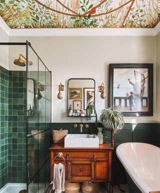 Bathroom with green tiles and mural ceiling