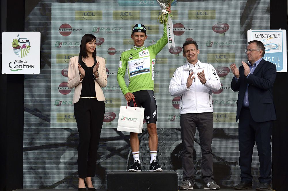 Michal Kwiatkowski celebrates his best sprinter's green jersey.