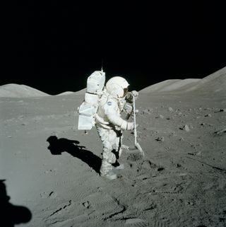 Scientist-astronaut, Jack Schmitt, rakes up regolith during the Apollo 17 expedition.