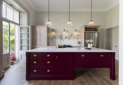 doors or drawers in a kitchen: harvey jones kitchen with red island pink cabinetry and wooden floor