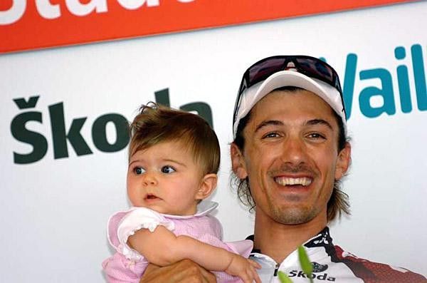 A happy Cancellara and daughter on the podium