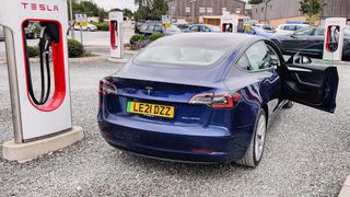Tesla Model 3 parked in charging station