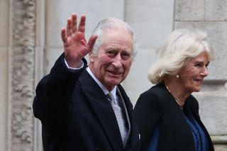 Britain's King Charles III (L) waves as he leaves, with Britain's Queen Camilla, the London Clinic, in London, on January 29, 2024. Britain's King Charles III, 75, stayed the London Clinic following prostate surgery on January 26, 2024.