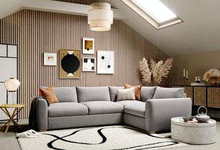 Japandi style living room with Snug cloud sofa textured rug and wood paneled wall and layered light sources