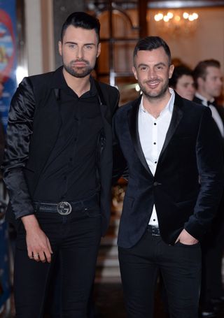 LONDON, ENGLAND - MARCH 26: (Left) Rylan Clark attends the press night of "I Can't Sing! The X Factor Musical" at London Palladium on March 26, 2014 in London, England. (Photo by Karwai Tang/WireImage)