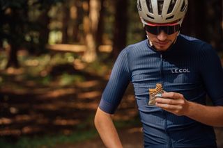 Male cyclist eating an energy bar during a bike ride