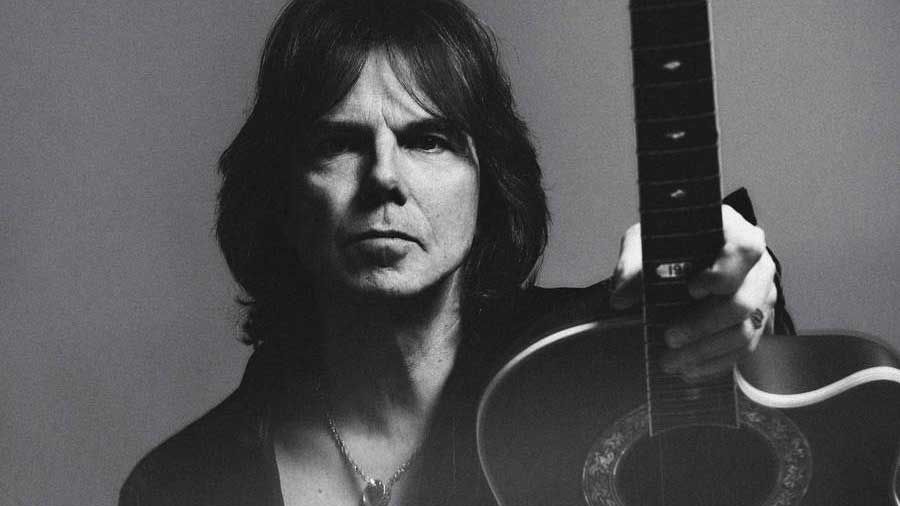 Joey Tempest holding an acoustic guitar