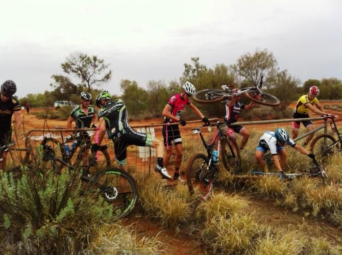 Lead riders jump the fence during stage 4