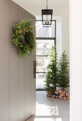 Minimal Christmas entryway styling by Marie Flanigan