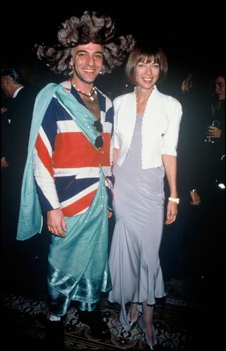 John Galliano and Anna Wintour at party