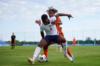 Rainy Breinburg of Netherlands U18 competes for the ball with Kobbie Mainoo of England U18 during the U-18 International friendly match between Netherlands U18 and England U18 at Pinatar Arena on September 21, 2022 in Murcia, Spain.