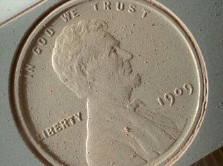 closeup of a dusty 1909 penny