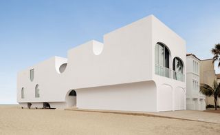 The resulting Vault House is a smooth, pure-white rectangular block, cut through with arches, vaults and curving skylights that open up oblique and overlapping views