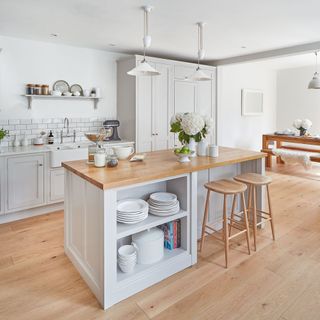 kitchen with white walls and wooden flooring and counter