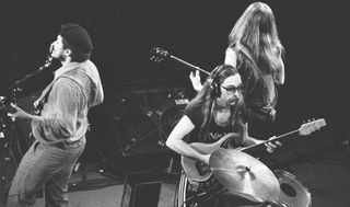 (from left) Tiran Porter, Patrick Simmons, and Jeff 'Skunk' Baxter of The Doobie Brothers perform on stage at Nippon Budokan in Tokyo, Japan in February 1979