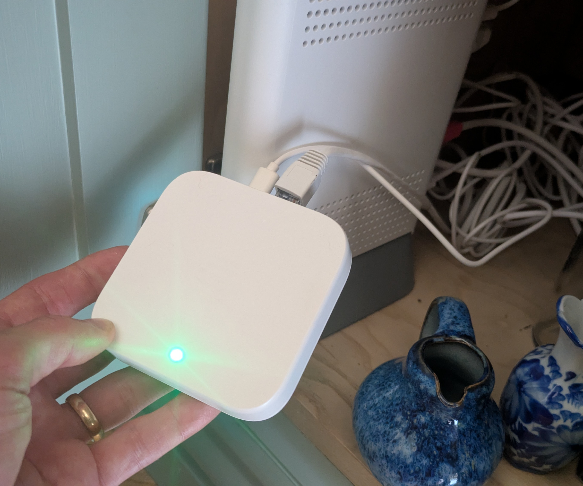 Hive smart hub connected to a router inside a cupboard