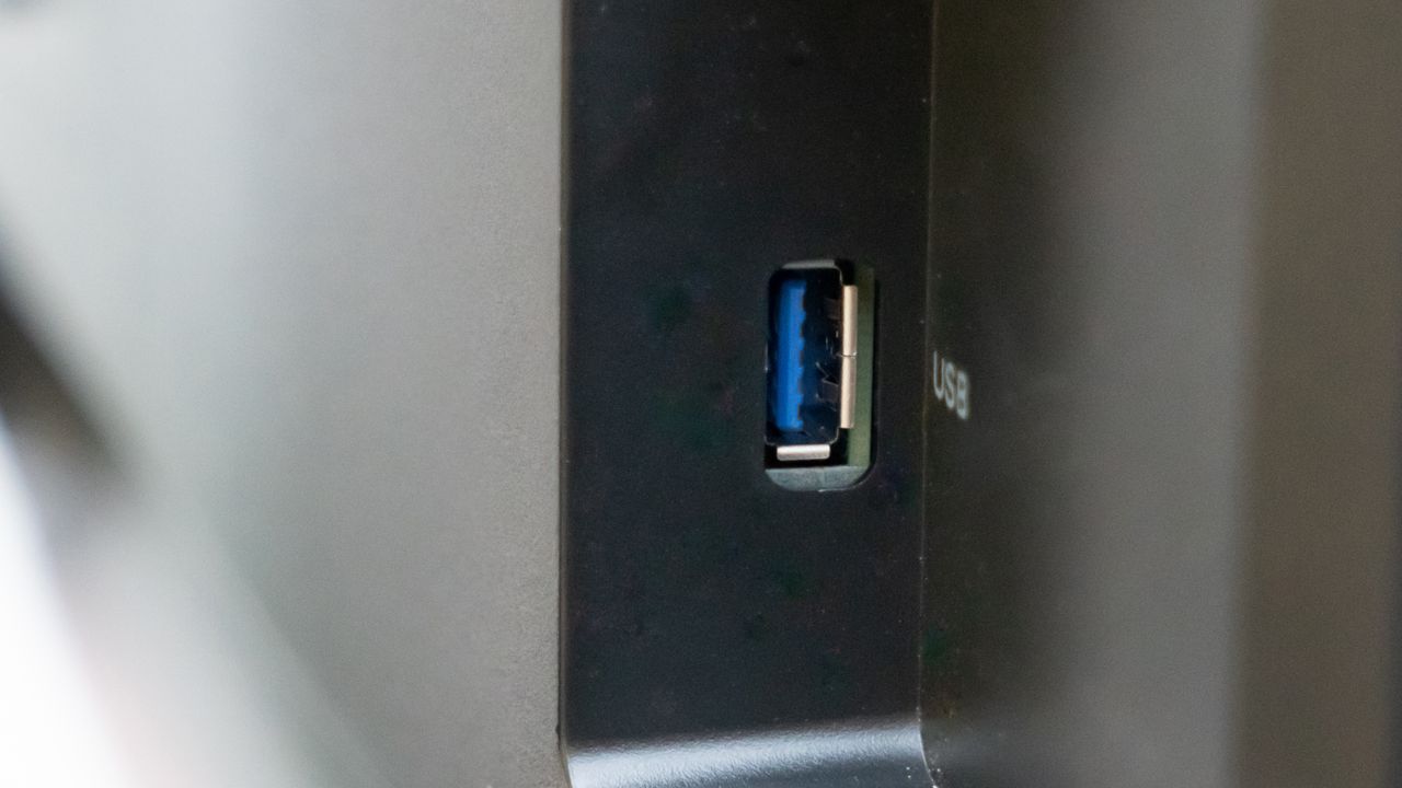 A black Philips 275B1H monitor sitting on a desk