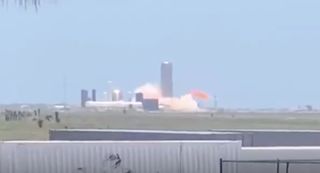 SpaceX's SN4 Starship prototype tests its Raptor engine during a static-fire trial in South Texas on May 19, 2020.