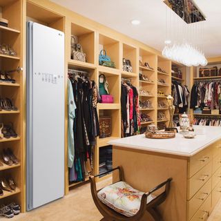 room with wooden shelves wooden desk and tiled flooring