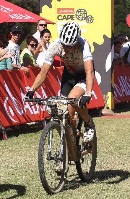 A dejected Jaroslav Kulhavy of Burry Stander-Songo hits the handlebars in frustration as he finishes after making a wrong turn