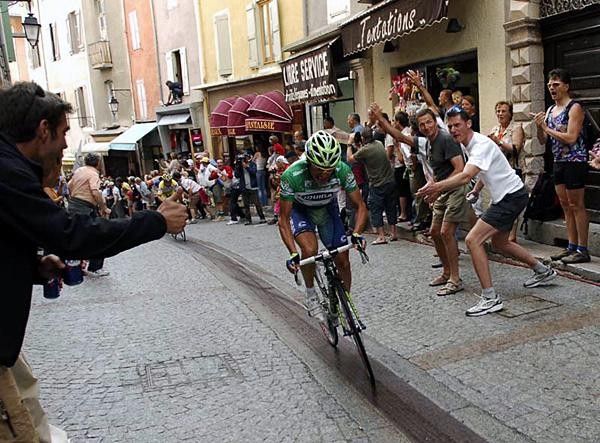 Di Luca Charges in the final metres.