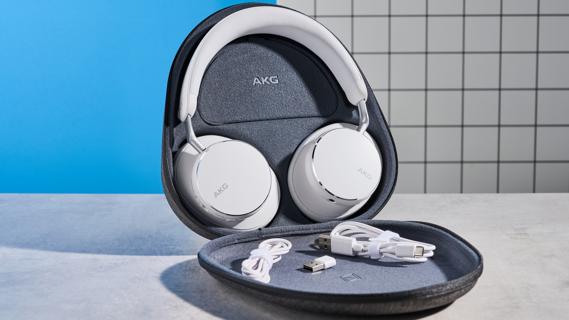 The AKG N9 Hybrid headphones photographed in front of a blue background.