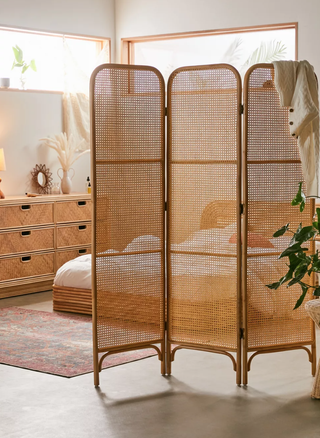 rattan room divider in a neutral bedroom