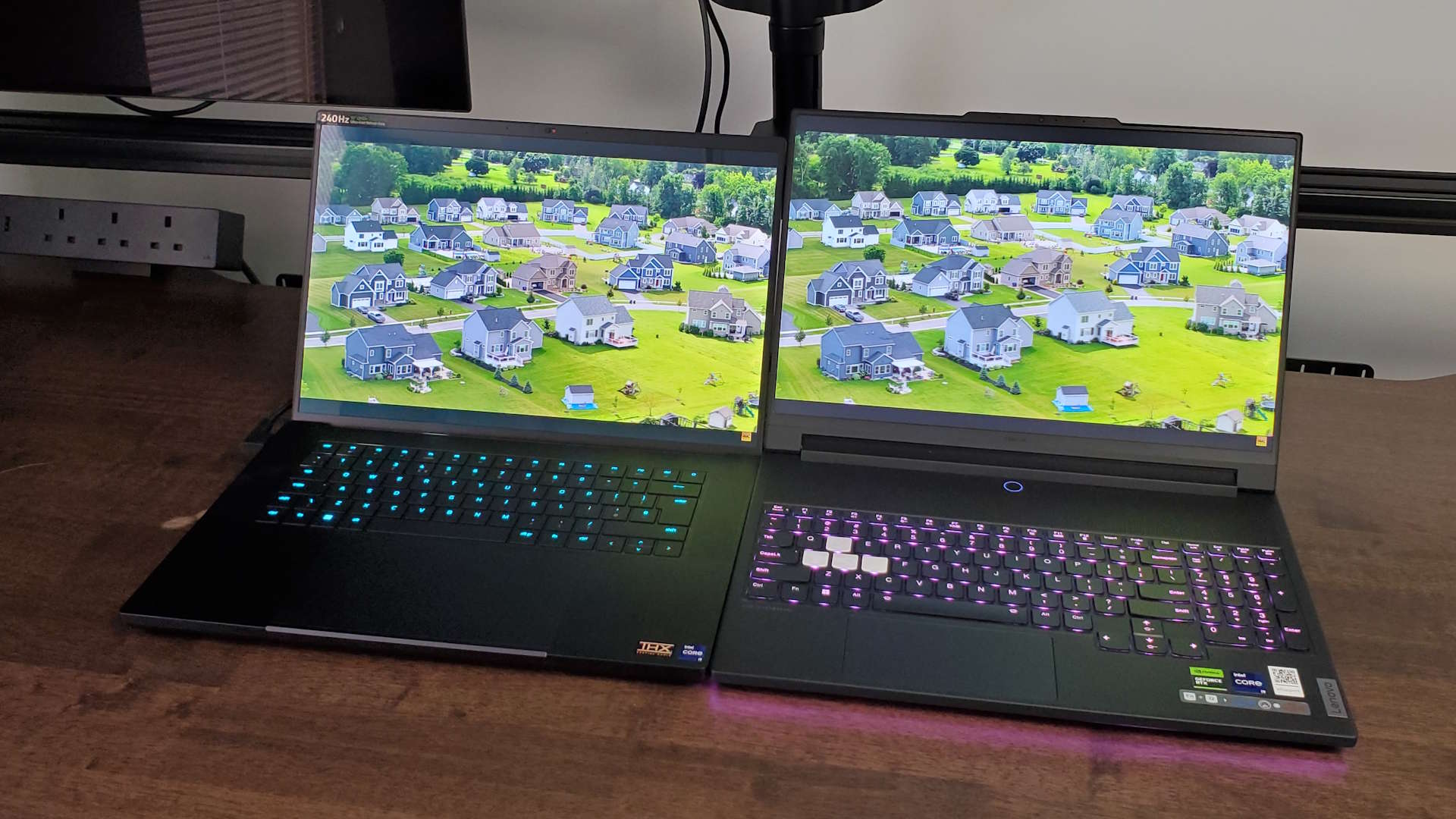 Razer Blade 16 (2024) and Lenovo Legion 9 gaming laptops side-by-side playing HDR content