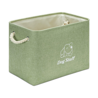 A sage green fabric storage basket for dogs