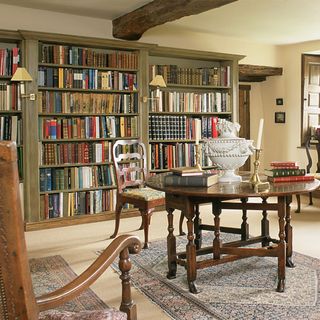 library with old books and wooden table