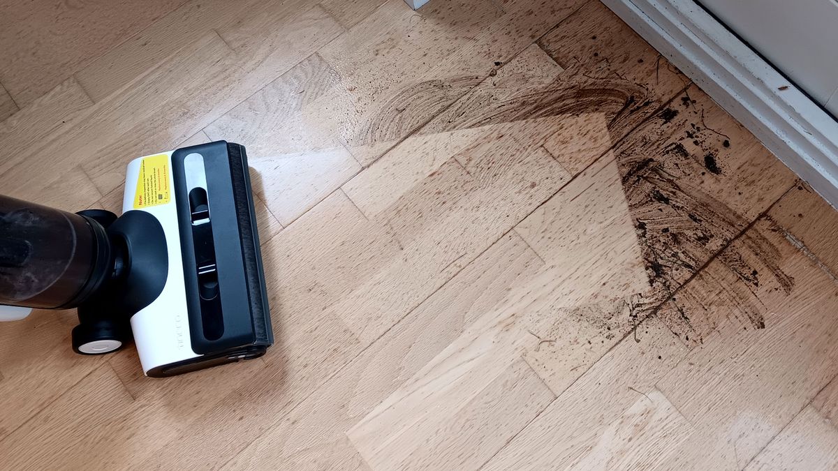 Tineco Floor One S6 cleaning mud off a hardwood floor