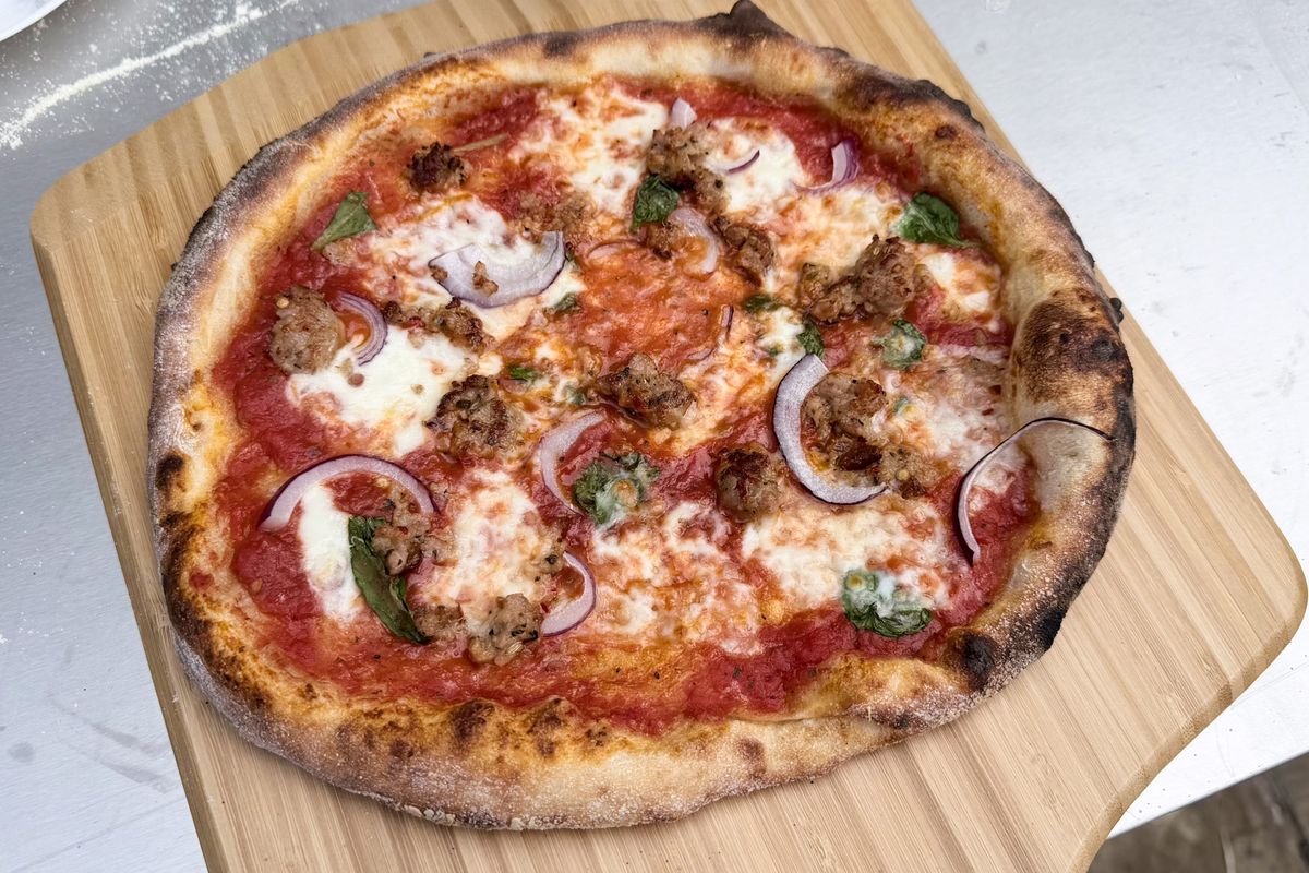 A pizza on a pizza peel