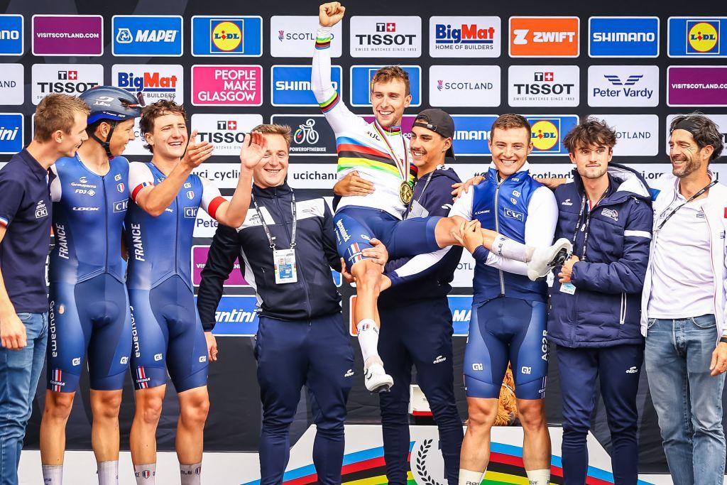 Axel Laurance celebrates with his French teammates after winning the U23 men road race