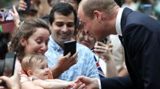 Prince William baby biting his finger