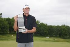 Steve Stricker lifting a trophy having won the American Family Insurance Championship