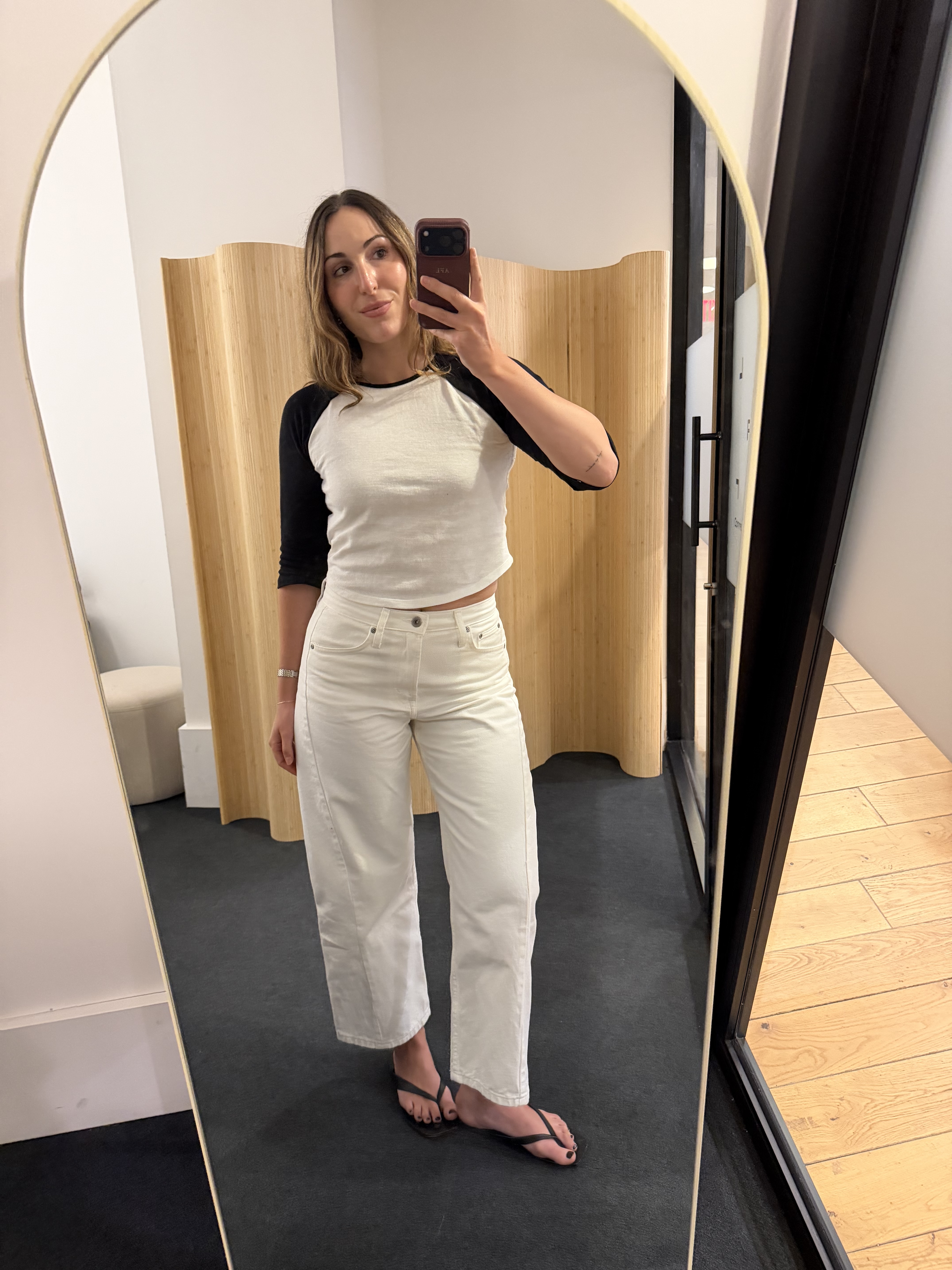 Anna LaPlaca in zara white jeans and a black and white t-shirt