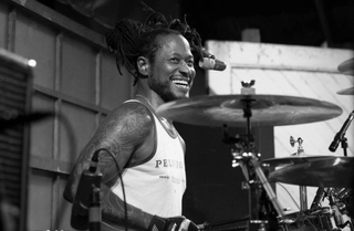 A picture of late Dead Kennedys drummer D.H. Peligro behind the kit
