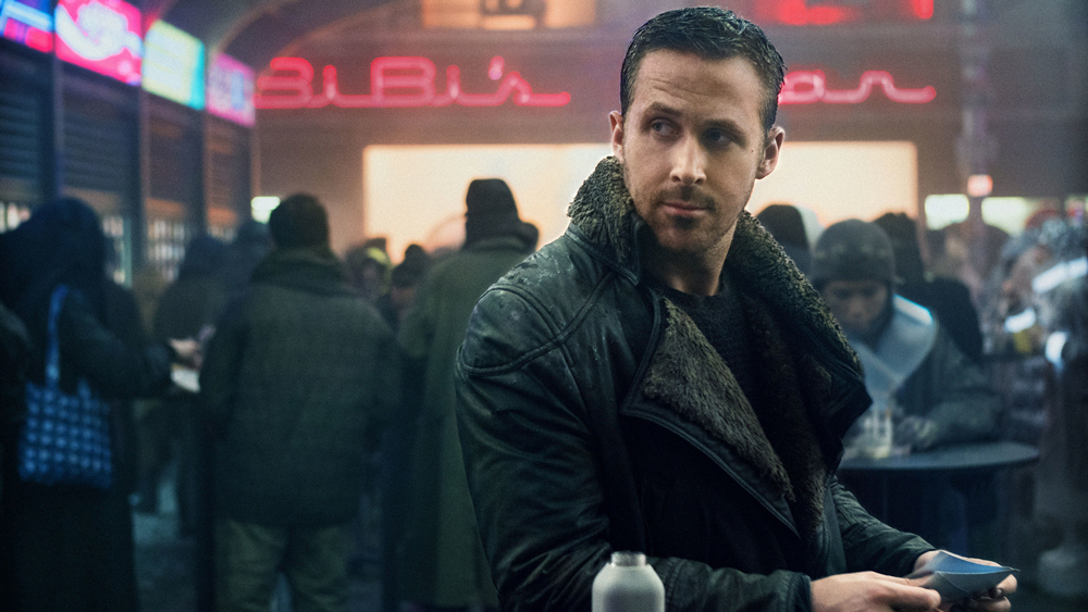 Agent K looks behind him at someone off camera in Blade Runner 2049