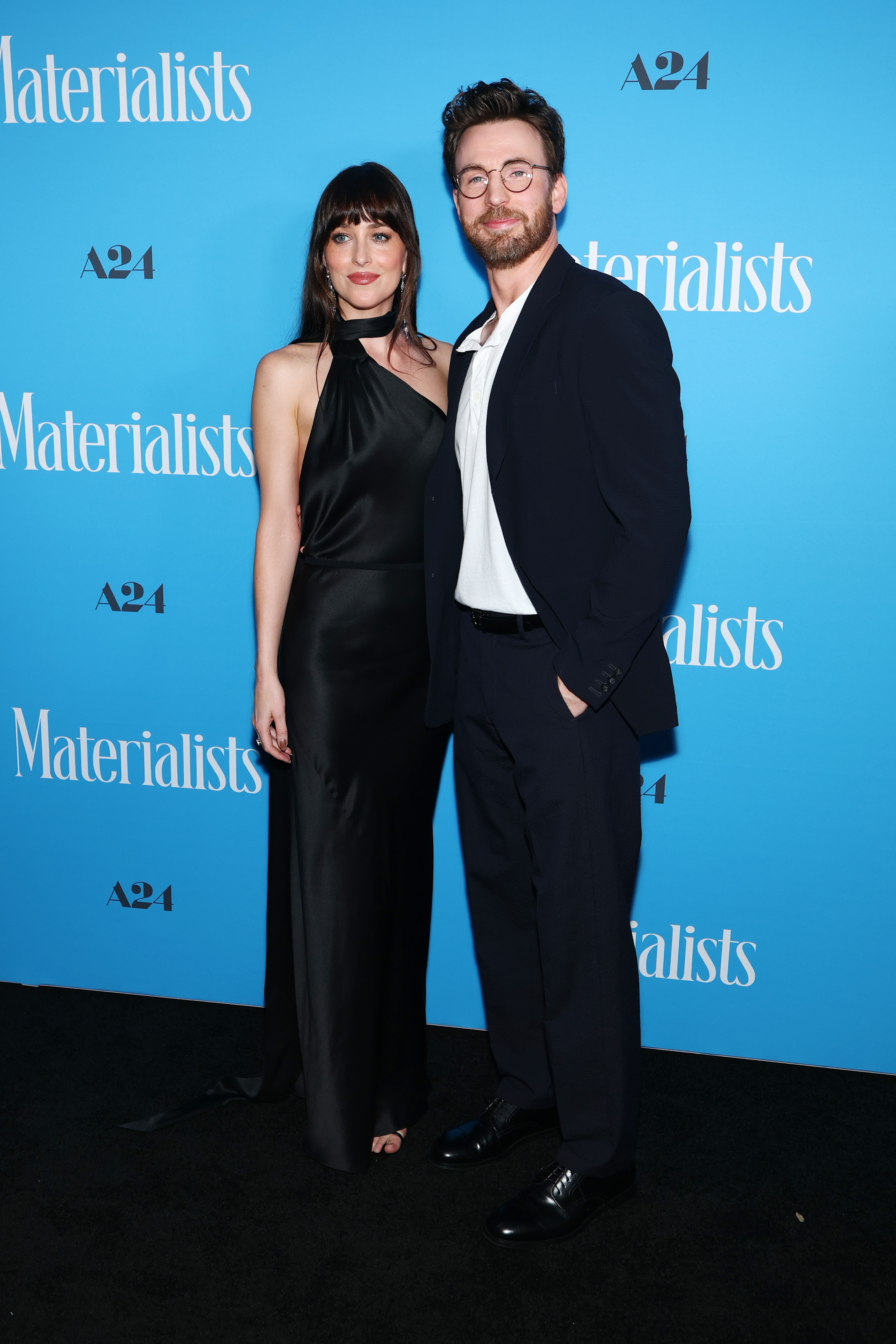Dakota Johnson wears a black asymmetrical Gucci gown for The Materialists premiere