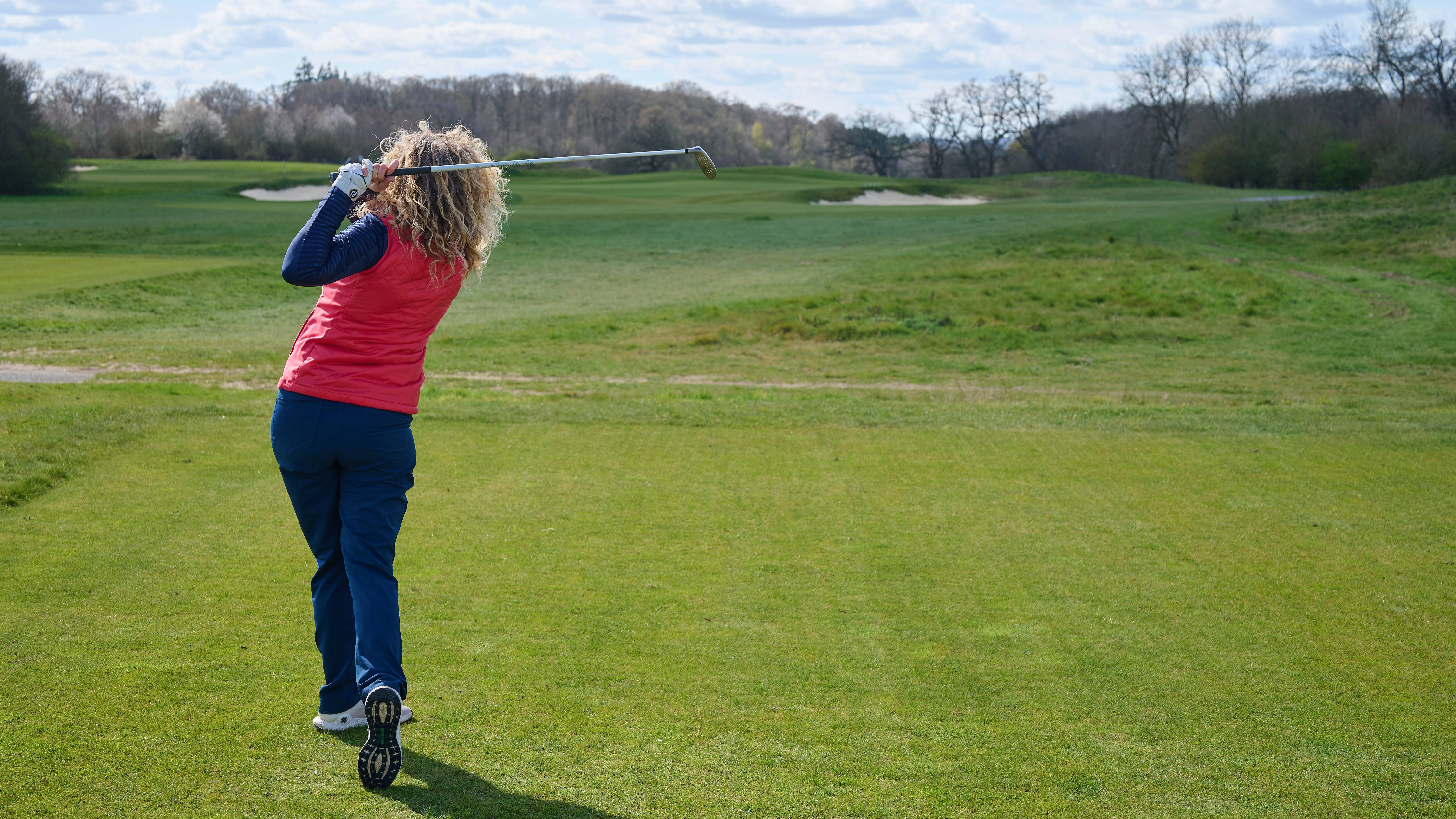Katie Dawkins hitting a hybrid off the tee