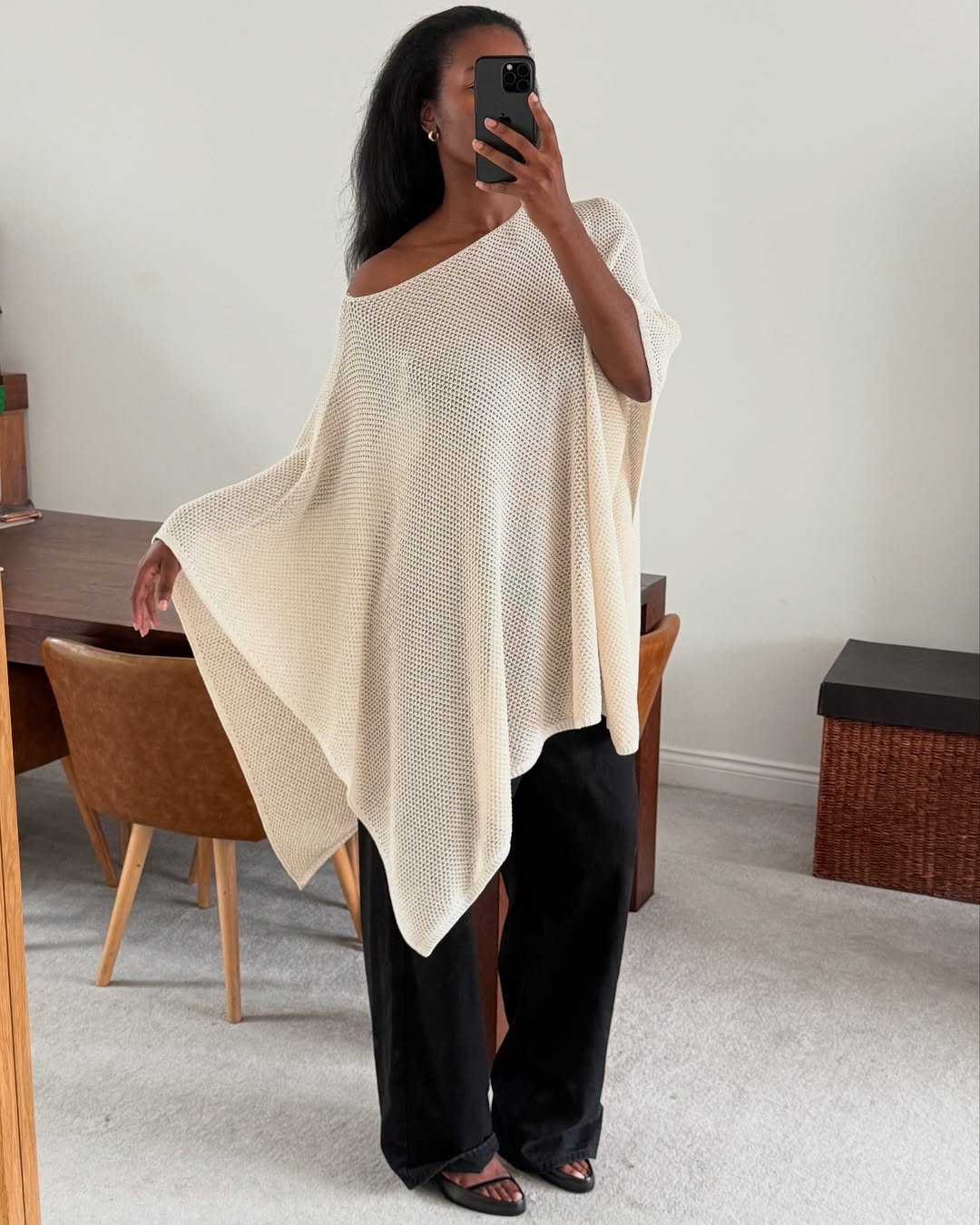 NLmarilyn wearing a knit poncho