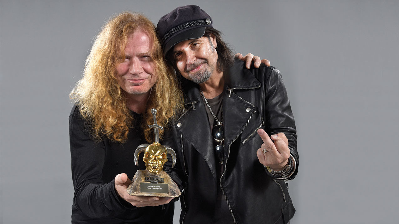 Dave Mustaine and Phil Campbell pose with an award at the Golden Gods 2016