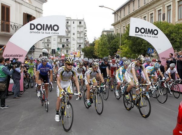 The peloton rolls off the start line in Lucera.