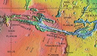 Valles Marineris in the east of Mars’ Tharsis volcanic region. Higher regions are marked red in this topographic map, while yellow and green indicate moderate elevations; the lowest points are shown in blue.