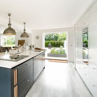 kitchen with white wall and cabinet