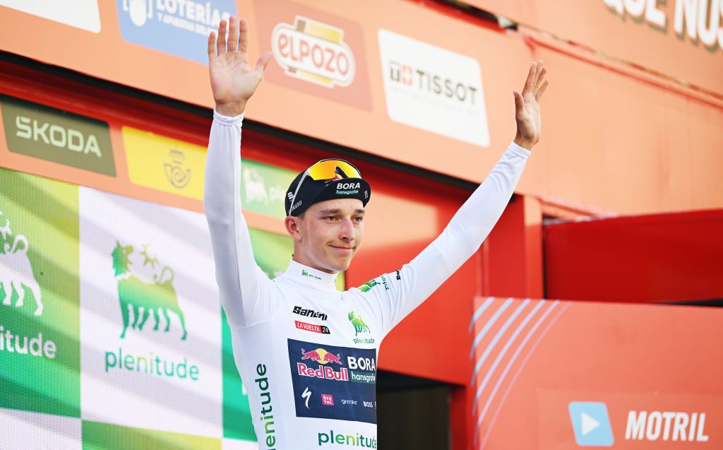 GRANADA SPAIN AUGUST 25 Florian Lipowitz of Germany and Team Red Bull Bora hansgrohe celebrates at podium as White Best Young Rider Jersey winner during the La Vuelta 79th Tour of Spain 2024 Stage 9 a 1785km stage from Motril to Granada UCIWT on August 25 2024 in Granada Spain Photo by Dario BelingheriGetty Images