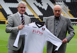 Mohamed Al Fayed and Mark Hughes on the football pitch at Fulham FC
